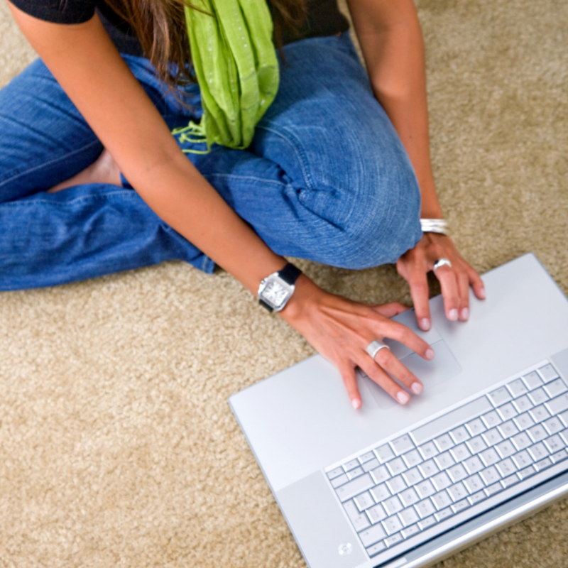 Lady on laptop on floor