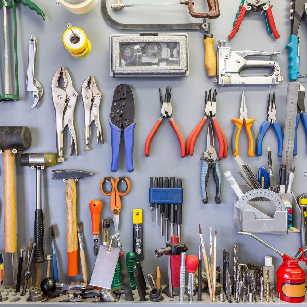 selection of tools lined up on a wall