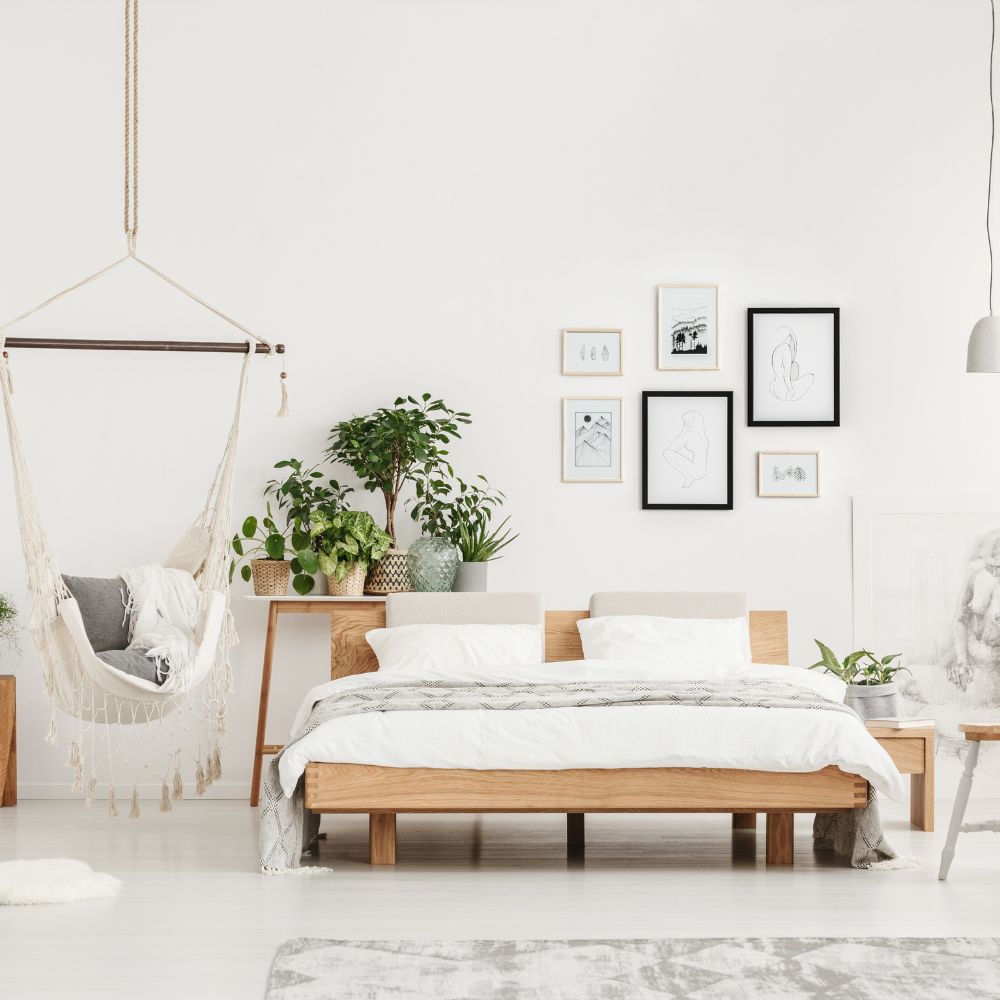 light and bright bedroom area with wooden furniture 